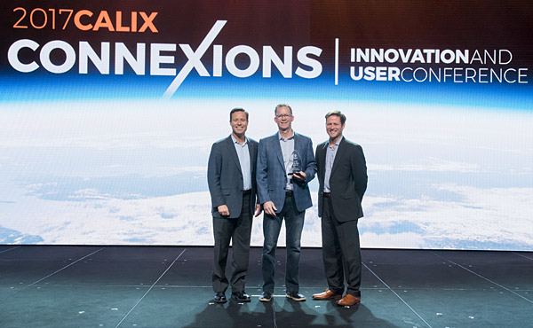 Paul Bunyan Communications CEO, Gary Johnson (center) is presented with the Calix Best Innovation in Residential Subscriber Experience for 2017